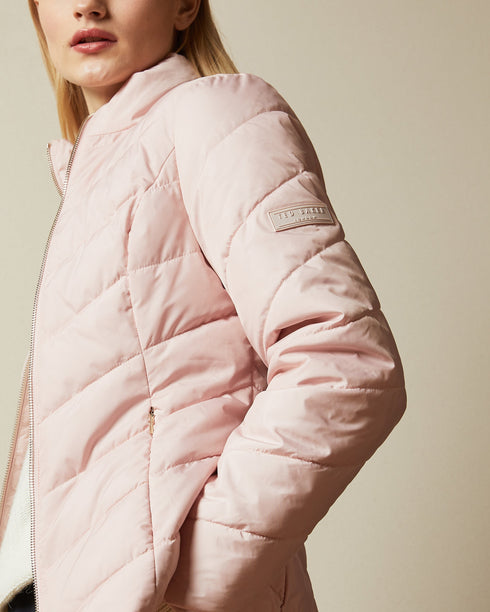 RENIKA-Outerwear-Don't let the weather catch you off guard. RENIKA's showerproof design ensures you stay dry in the unpredictable British weather, and it's easy to carry with its convenient packaway drawstring pouch. Padded jacket Showerproof Packaway drawstring pouch Zip fastening Funnel neck Long sleeves Awuoi is 5'10.5" / 1.79m and wears Black in a Ted size 1- Ted Baker Romania